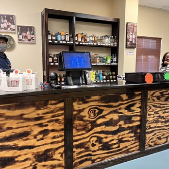 Spirits Express - a man and a woman behind the counter - Beer, Wine & Spirits Near Me - Ladson, South Carolina