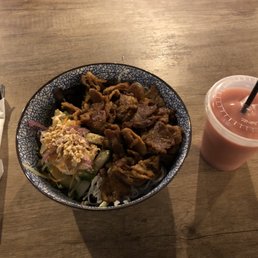 a bowl of food and a drink a bowl of food and a drink