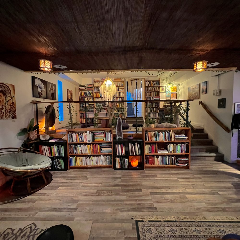 Alternity - a living room with a bookshelf - Lounges Near Me - Toronto, Ontario