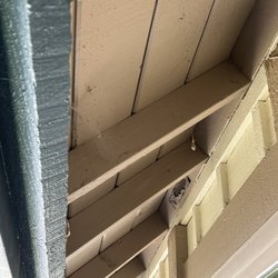 Greene Pest Solutions - Before: tons of spider webs collecting bugs, gnats, insects & leaves underneath my overhang by my front door