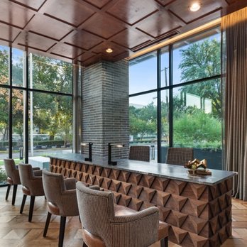 Alseb Group - a dining room with a large table and chairs - General Contractors Near Me