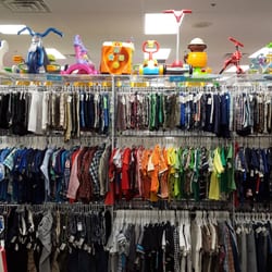Once Upon A Child - Clothing items divided by gender, size, and color.