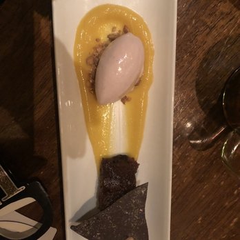 Vedge - Ice Cream of pink Peppercorns on a bed of crushed pistachios. Passion fruit curd cake. - Vegan Near Me - Philadelphia, Pennsylvania Vedge - Ice Cream of pink Peppercorns on a bed of crushed pistachios. Passion fruit curd cake. - Vegan Near Me - Philadelphia, Pennsylvania