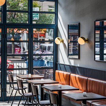 Le Midi Wine - Le Midi interior tables and windows - Wine Bars Near Me - Chicago, Illinois