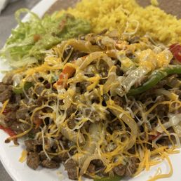 Steak fajitas (yes, they put cheese on it. Not my request). Steak fajitas (yes, they put cheese on it. Not my request).