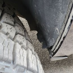 Damaged door frame and busted up wheel wells