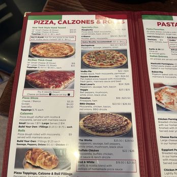 Amici Pizza - Menu - A menu page from Amici Pizza displays options for pizza, calzones, specialty pies, and pasta dishes. It includes prices for small and large pizzas, calzones stuffed with ricotta and mozzarella, and various pasta favorites. The menu also offers toppings, build-your-own options, and additional items like garlic knots and specialty pies such as Bacigalupo and Vodka Pie. The layout is organized with sections and descriptions of each dish. - Pizza Near Me - Mesa, Arizona