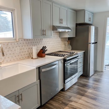 Take Pride Construction - a kitchen with stainless steel appliances - General Contractors Near Me