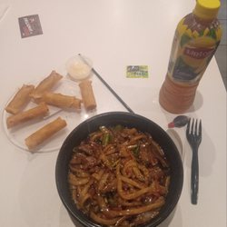 Shuji Sushi - My full Lunch Order.   Beef noodles, a lemon iced tea and some vegetarian spring rolls on the side with a dipping sauce.