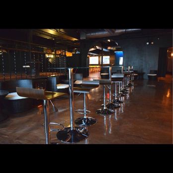 Mes Lounge - a row of bar stools and tables - Lounges Near Me - Buffalo, New York