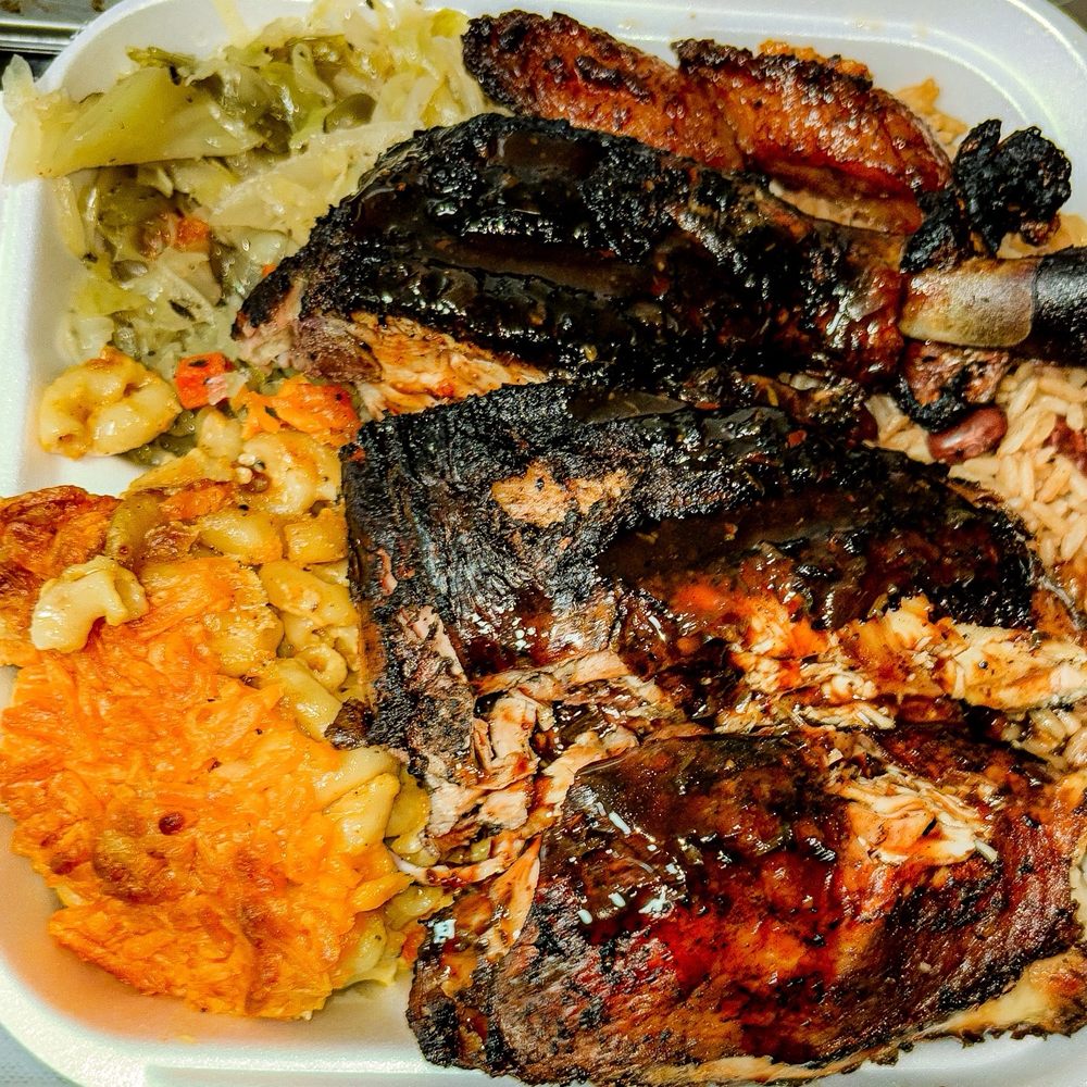 Jerk chicken with rice and beans, cabbage and Mac n cheeses Jerk chicken with rice and beans, cabbage and Mac n cheeses