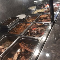a buffet with a variety of food items a buffet with a variety of food items