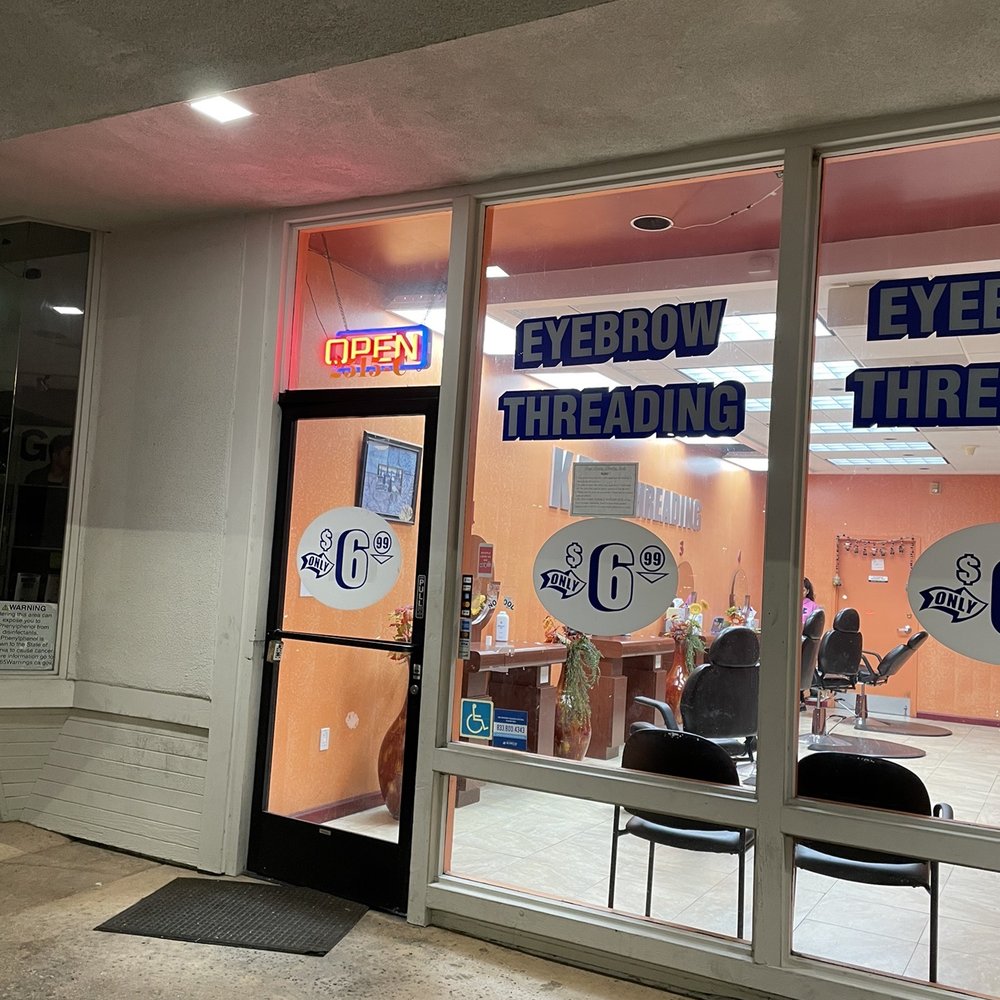 Open sign showing business is open but employee doing nothing inside refuses service. Open sign showing business is open but employee doing nothing inside refuses service.