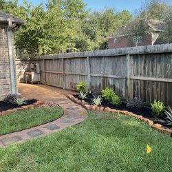 Hector's Landscaping - Walkway and flower beds