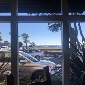 Mezza Luna Restaurant - Monterey Bay visible over the empty field - Italian Near Me - Half Moon Bay, California