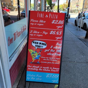 Fire Pizza - a sign on the sidewalk in front of a restaurant - Pizza Near Me - Vancouver, British Columbia