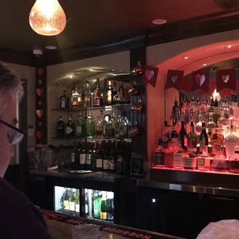 Tellawi Lounge - a man sitting at a bar - Lounges Near Me - Fresno, California