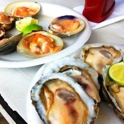 Tito's Oysters - Oysters, clams... Some hot sauce and mango hot sauce... Everyday.