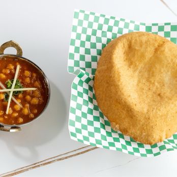 Tamarind Tales - Chana masala curry with bhattura - Indian Near Me - Vancouver, British Columbia Tamarind Tales - Chana masala curry with bhattura - Indian Near Me - Vancouver, British Columbia