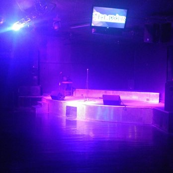 Elixir Nightclub - a stage with purple lighting - Dive Bars Near Me - Cabot, Arkansas
