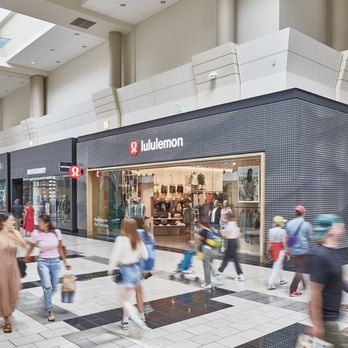 Washington Square - Shoppers pass the lululemon storefront inside Washington Square. - Shopping Centers Near Me - Portland, Oregon Washington Square - Shoppers pass the lululemon storefront inside Washington Square. - Shopping Centers Near Me - Portland, Oregon