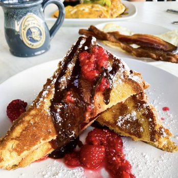 Another Broken Egg Cafe - Guava Filled French Toast with a side of eggs and baked bacon - Breakfast & Brunch Near Me - Oviedo, Florida Another Broken Egg Cafe - Guava Filled French Toast with a side of eggs and baked bacon - Breakfast & Brunch Near Me - Oviedo, Florida