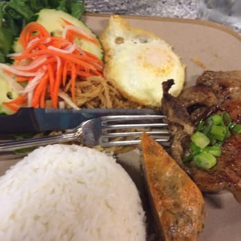 King Pho - Combo Plate with Pork Chops, Meat Loaf, and Pork Skin Strips (?).   Served with fried egg, veggies, and rice. - Vietnamese Near Me - Chicago, Illinois