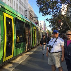 Amazing Melbourne Tours - Catching a tram in downtown Melbourne