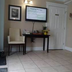 Sackville Naturopathic Health Centre - Waiting room with a TV showing slide shows with health tips