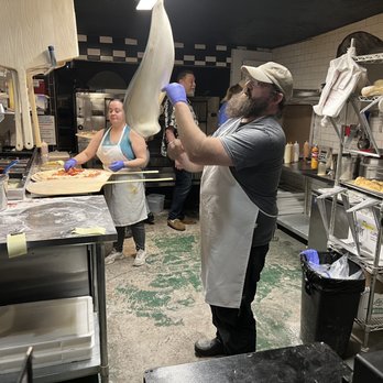 Empire State Pizza - One of Empire State Pizza's amazing chefs tossing the pizza in the air - Pizza Near Me - Greeley, Colorado Empire State Pizza - One of Empire State Pizza's amazing chefs tossing the pizza in the air - Pizza Near Me - Greeley, Colorado