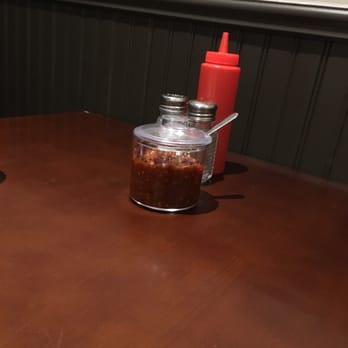 Hakka 77 - The necessary hot sauce at the table. - Hakka Near Me - Richmond Hill, Ontario Hakka 77 - The necessary hot sauce at the table. - Hakka Near Me - Richmond Hill, Ontario