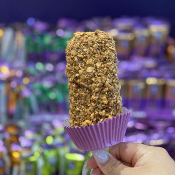 Purdy's Chocolatier - a hand holding a chocolate covered popsicle - Chocolatiers & Shops Near Me - Richmond, British Columbia