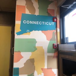 a colorful wall with a sign that says connecticut a colorful wall with a sign that says connecticut