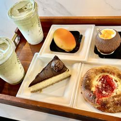 Raha Coffee House - Iced matcha, coconut and regular. Mango pastry, coconut pastry, strawberry cheese danish, Ferrero rancher cheesecake.