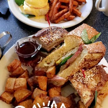 Studio One Cafe - French toast sandwich w/ ham and house fries in the front and eggs benedict w/ sweet potato fries in the back. Highly recommend both! - Breakfast & Brunch Near Me - Eugene, Oregon