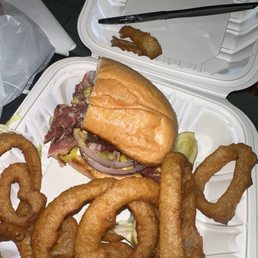 Pastrami sandwich with onions and onion rings Pastrami sandwich with onions and onion rings