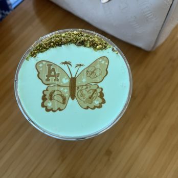 Honey Greens Cafe - Los Angeles butterfly design, vanilla rose with pistachio cloud foam - Juice Bars & Smoothies Near Me - Downey, California Honey Greens Cafe - Los Angeles butterfly design, vanilla rose with pistachio cloud foam - Juice Bars & Smoothies Near Me - Downey, California