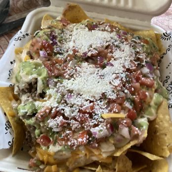 Chilacos Tacos - Nachos piled high - Tacos Near Me - Plantation , Florida