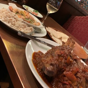 Bosphorous - Winter Garden - His lamb shank and her shrimp sauteed in lemon sauce with turkish rice wow - Middle Eastern Near Me - Winter Garden, Florida