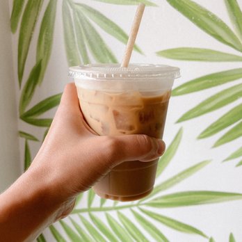 Queenstage Coffee House - Cafe De Olla iced drink against their wall mural. Delicious! - Coffee & Tea Near Me - Encinitas, California