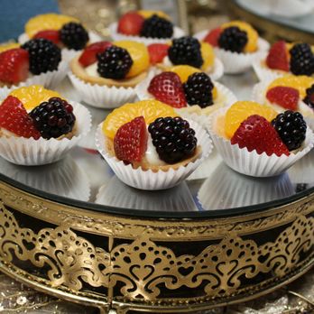 The Queen's Kitchen - a tray of cupcakes with fruit on them - Caterers Near Me - Alamo, Texas