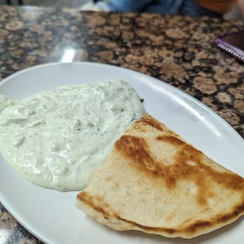 Chris' Taverna - Free pita and literal buckets of tzatziki sauce - Greek Near Me - Boynton Beach, Florida Chris' Taverna - Free pita and literal buckets of tzatziki sauce - Greek Near Me - Boynton Beach, Florida