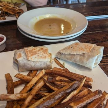 Chatty Monks Brewing - Mango Coconut Chicken wrap, fresh cut fries and an empty plate of mussels with the most flavorful sauce. - New American Near Me - West Reading, Pennsylvania