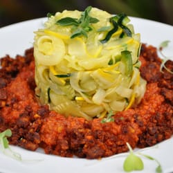 Perkunas Core - veggie Vibes Organic Raw Vegan Pasta, with marinara sauce, grounded spicy walnuts, fresh herbs and raw-vegan Alfredo sauce