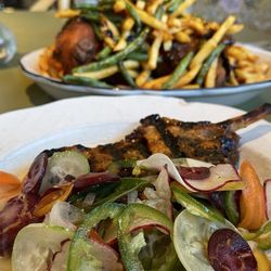 Vietnamese pork chop with gluten-free fried chicken in the background
