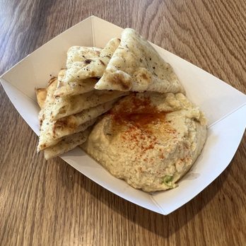 Nick The Greek - Side of pita with hummus - Greek Near Me - Irving, Texas Nick The Greek - Side of pita with hummus - Greek Near Me - Irving, Texas