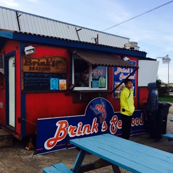 Brink's Seafood - a man standing in front of a booth - Food Trucks Near Me - Kingsville, Texas Brink's Seafood - a man standing in front of a booth - Food Trucks Near Me - Kingsville, Texas