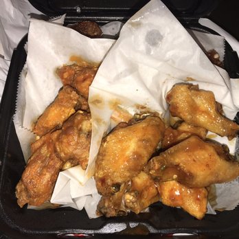 Fire Wings - Fire on the left, mango habanero on the right - Chicken Wings Near Me - Sacramento, California Fire Wings - Fire on the left, mango habanero on the right - Chicken Wings Near Me - Sacramento, California