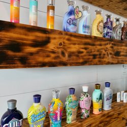 Coastal Sun Spa - Shop Devoted Creations tanning lotions, bronzers, and skincare at Coastal Sun Spa to enhance your tan and keep skin hydrated and radiant!