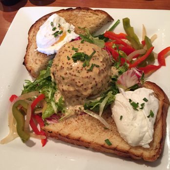 Blue's Egg + Bakery - Crab cake with poached eggs, challah toast, mixed greens, pickled peppers, and remoulade - Breakfast & Brunch Near Me - Milwaukee, Wisconsin